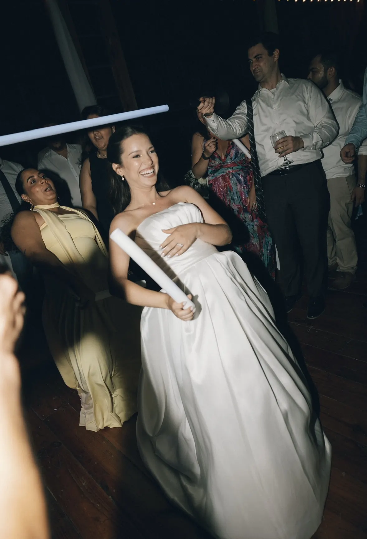 Smiling bride dancing at her wedding reception
